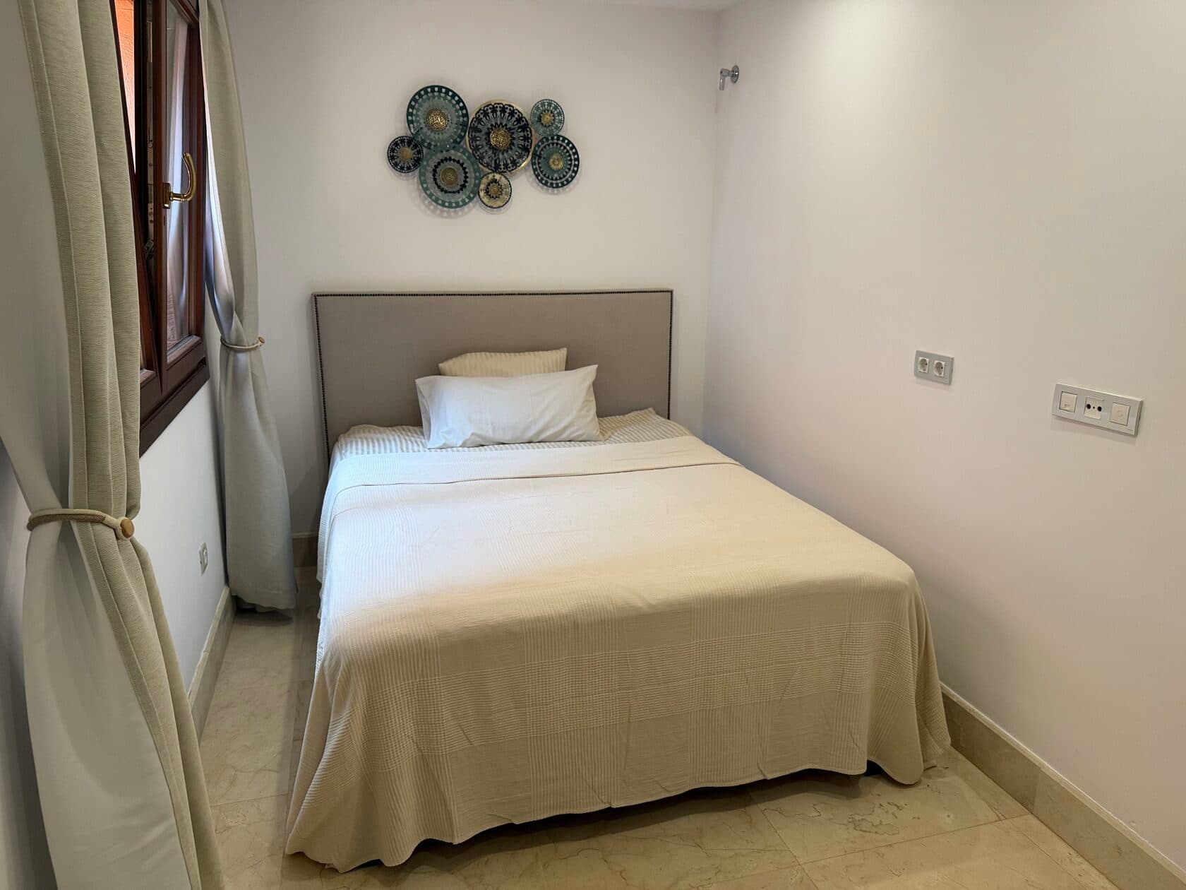 Single bedroom with decorative wall art