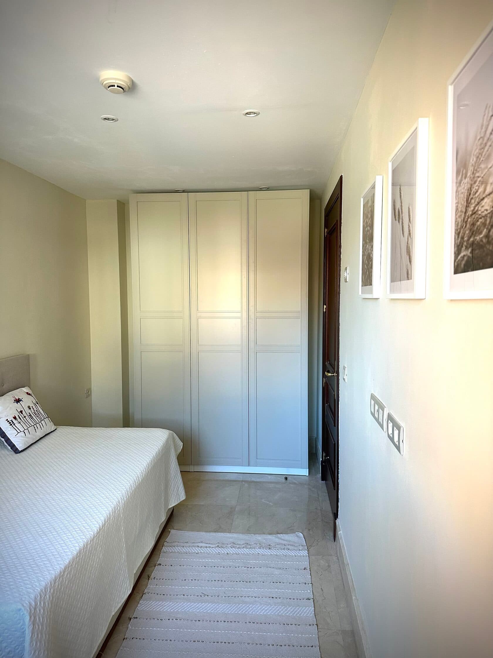 Single bedroom wardrobe and artwork